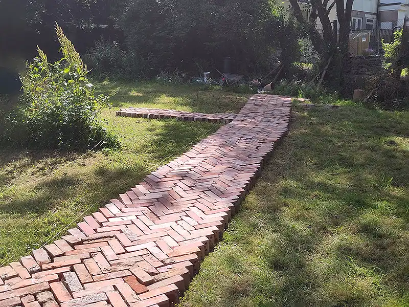 An image of the path nearing completion and laid out in herringbone style
